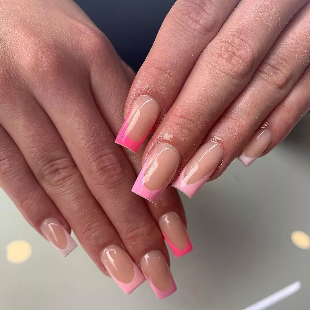 Person shows off their square nails, featuring a pink French tip gradient
