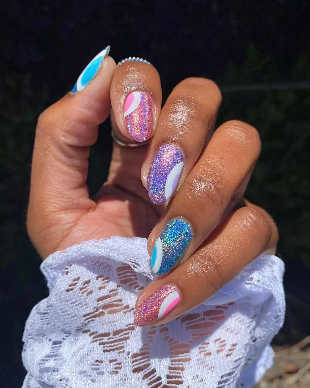 pink, purple, and blue glitter manicure