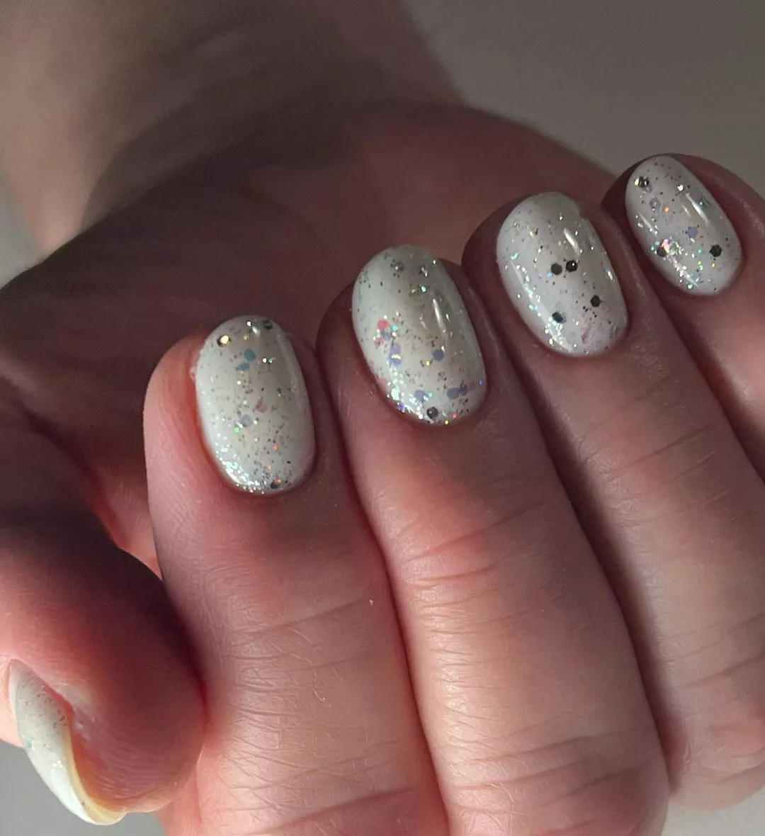 white manicure with glitter