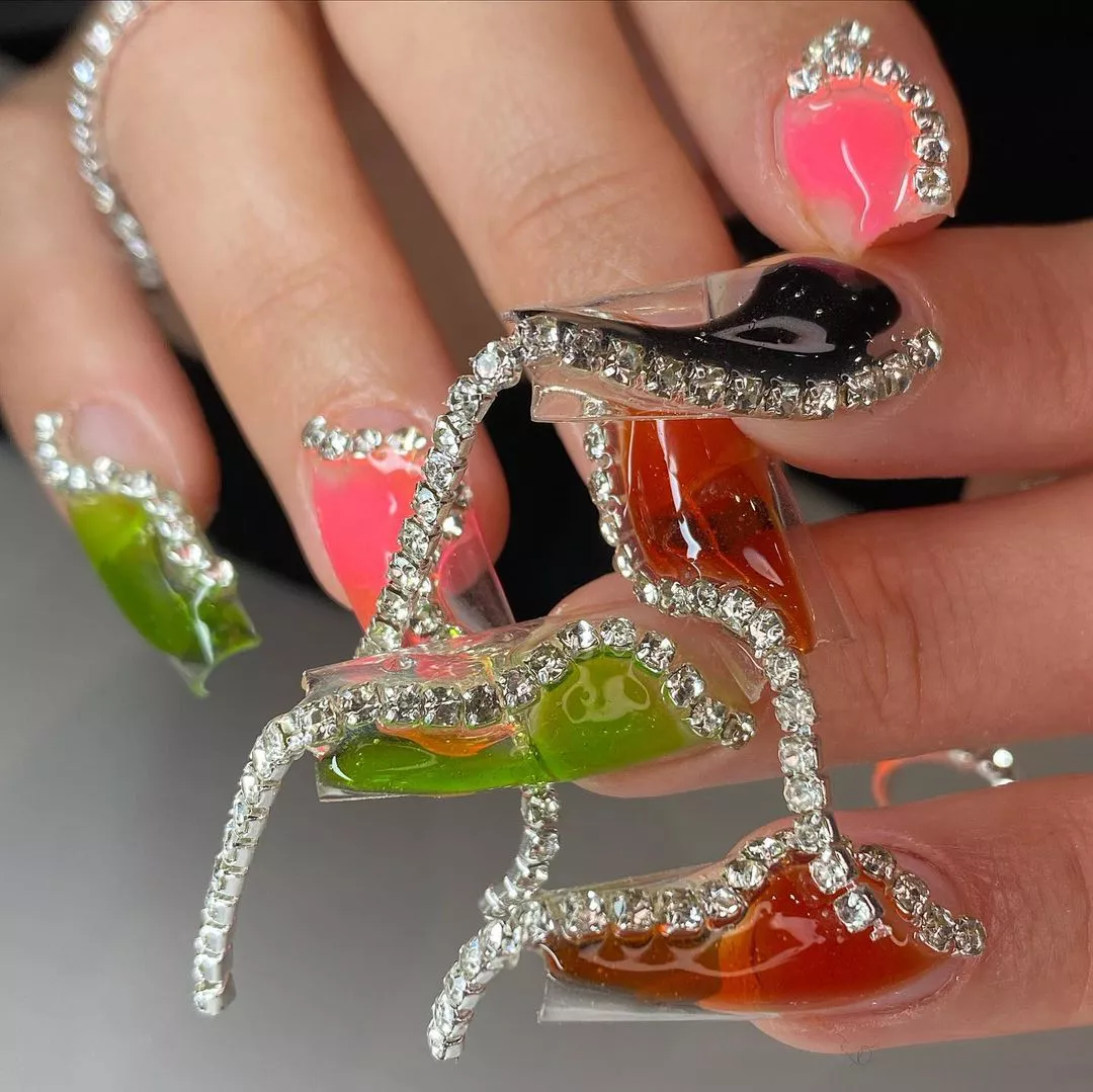 Detailed and decorated diamond fingernail designs in different jelly-like colors