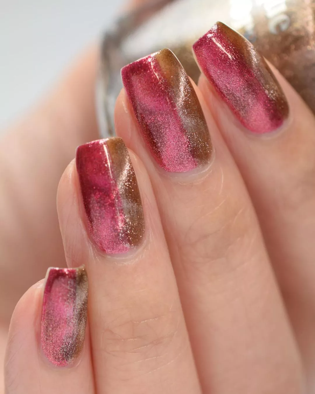 Pink and gold glitter vertically divided manicure