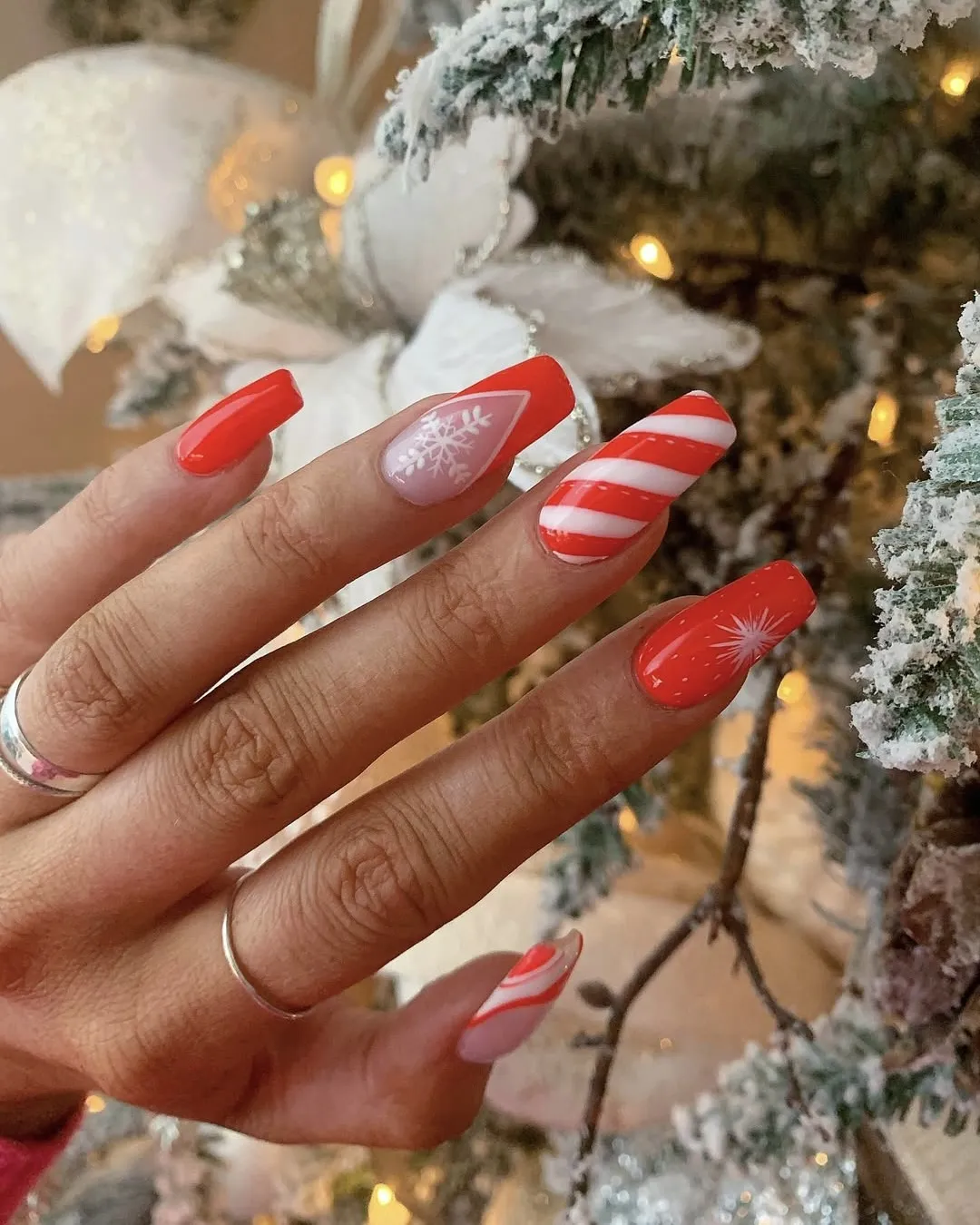 Peppermint red snowflake nails.