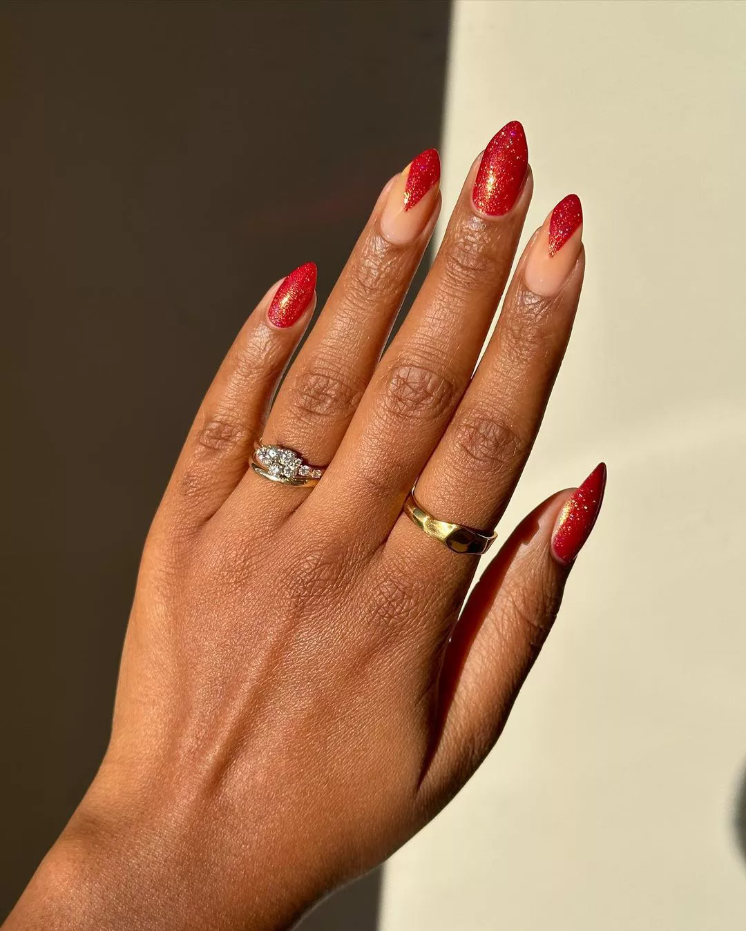 diamond shaped nails with red glitter polish