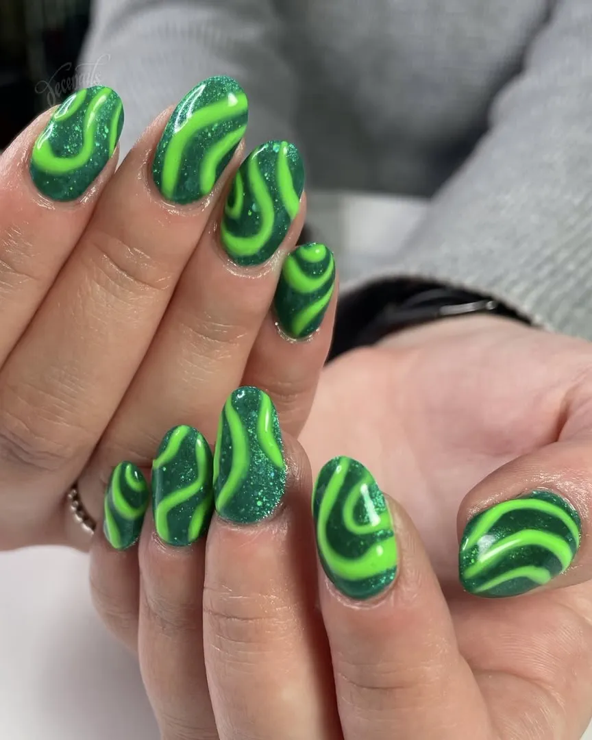 Lime green swirl nails.