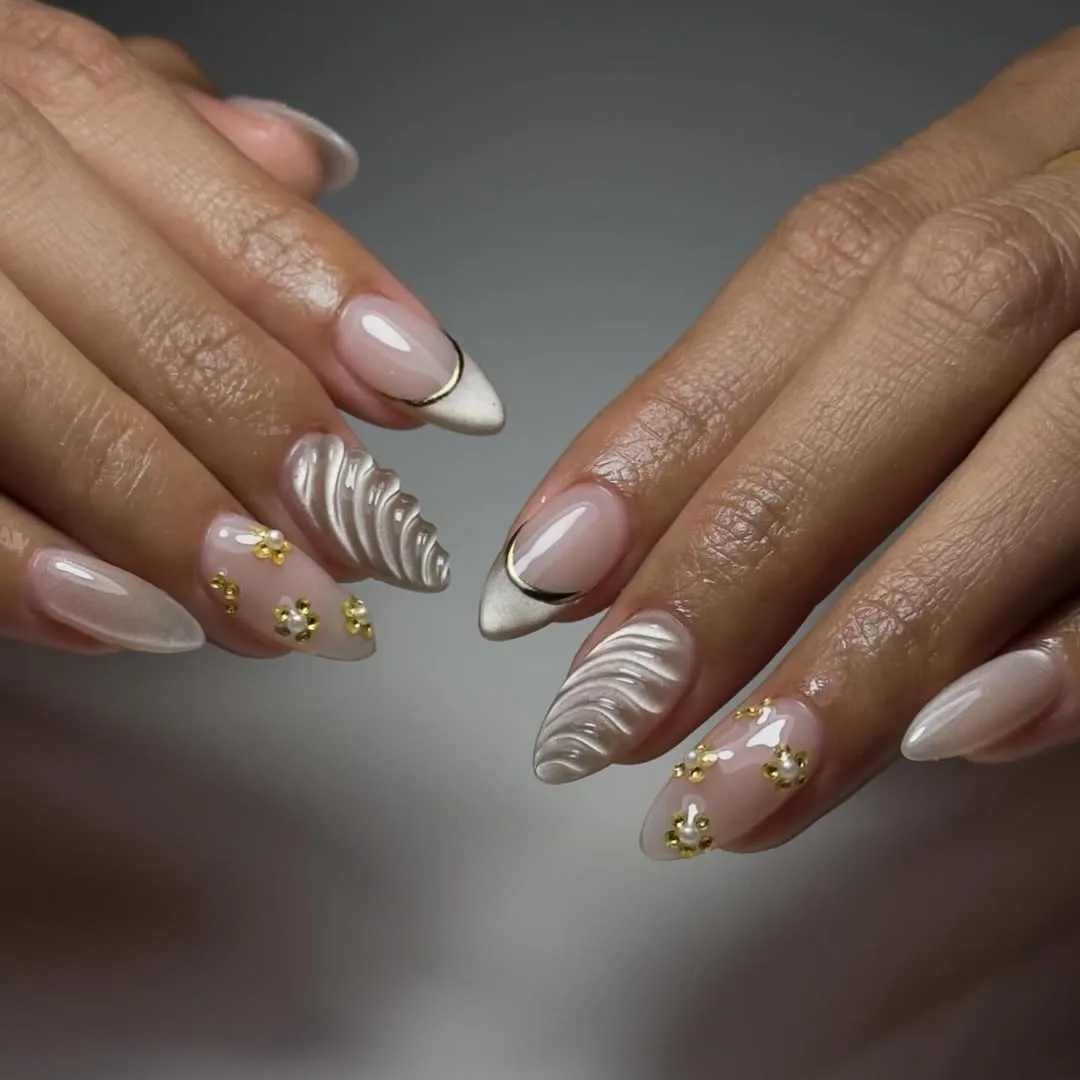 Nude and gold nails with 3D designs