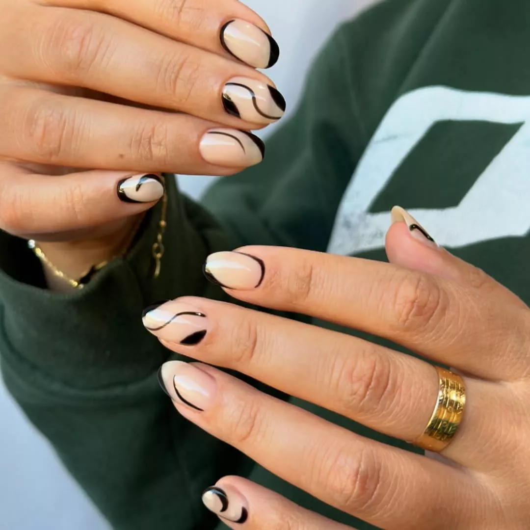 Delicate black lines on nude nail base