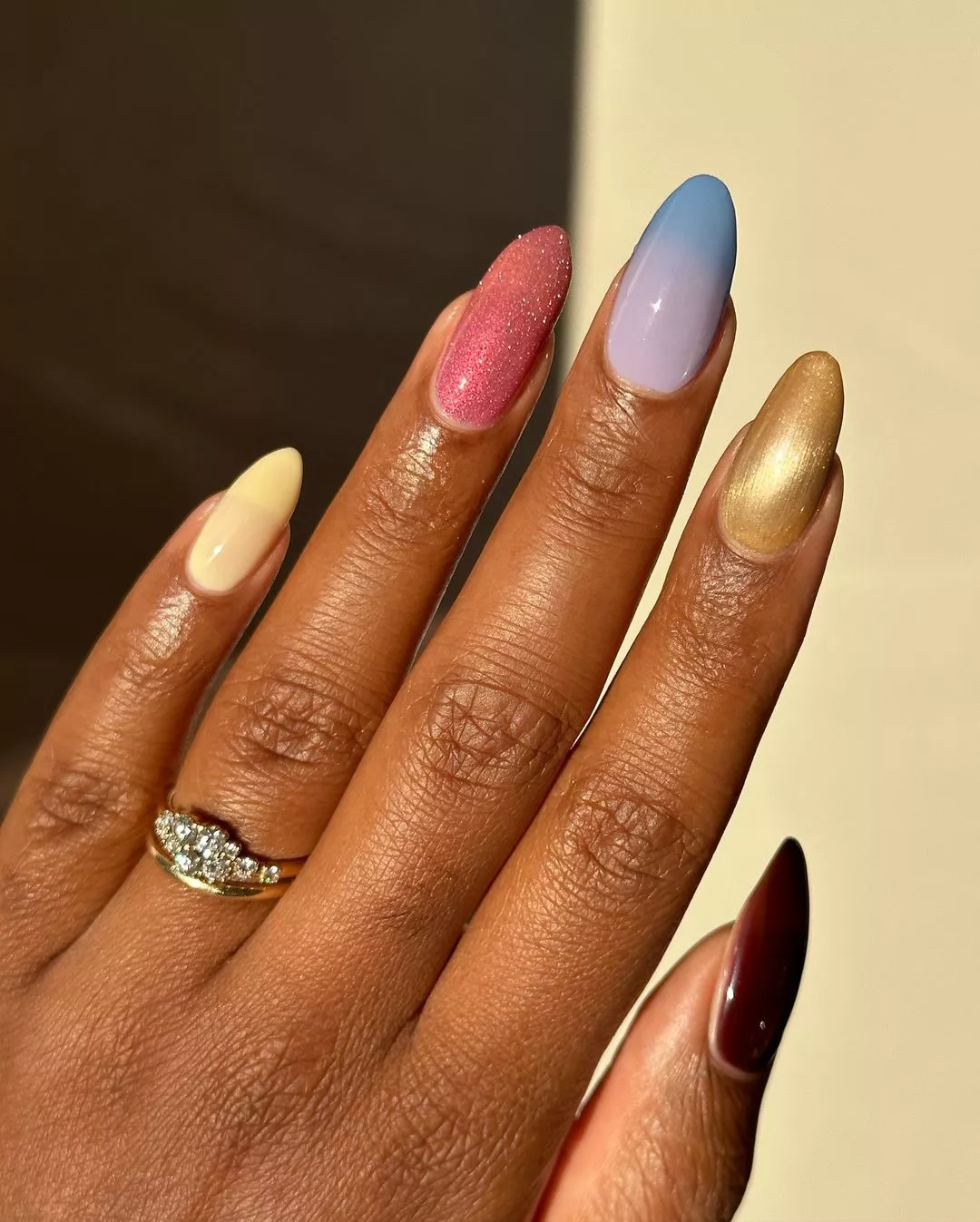 different colors and designs on each nail in this beautiful manicure
