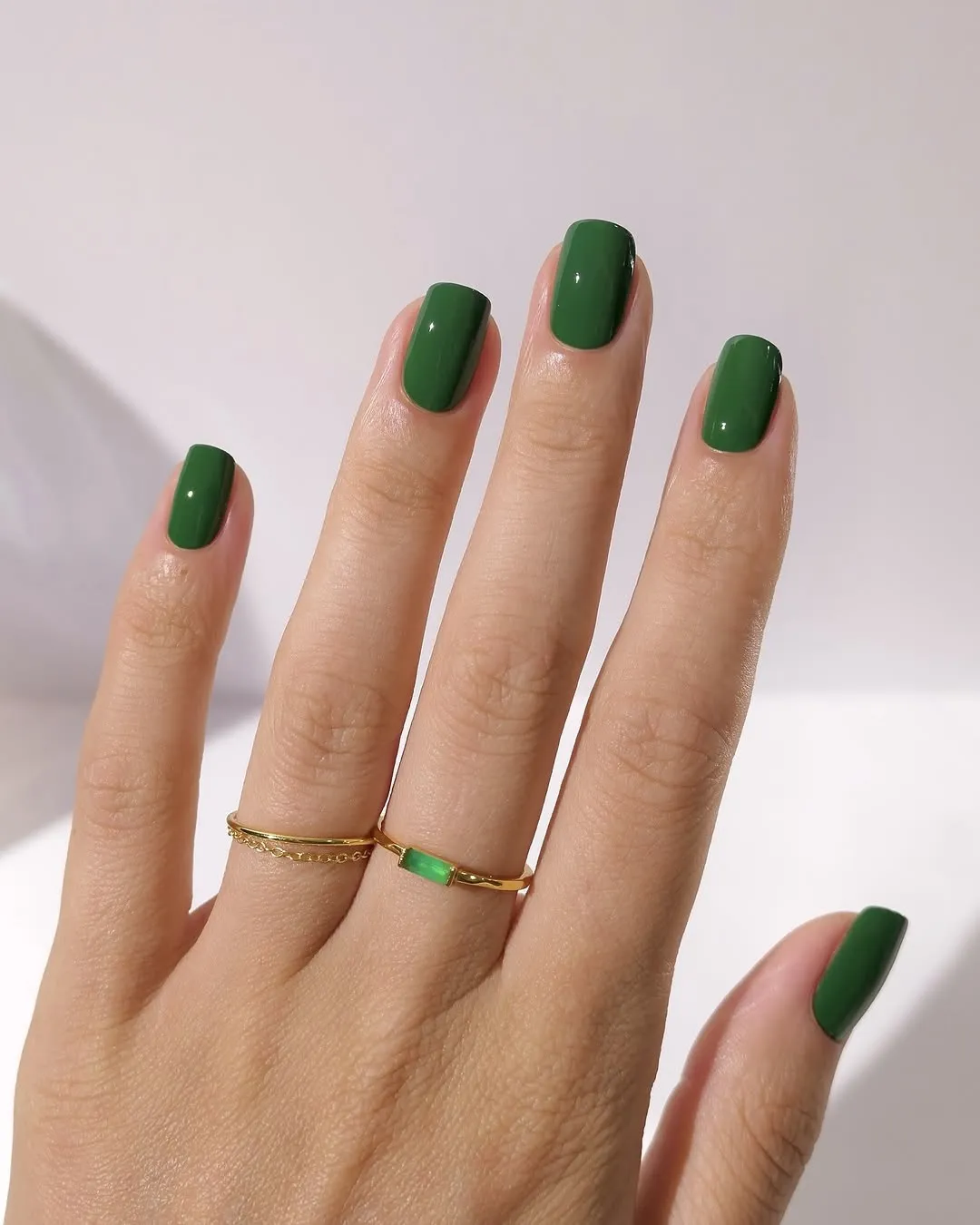 Glossy forest green Christmas manicure.