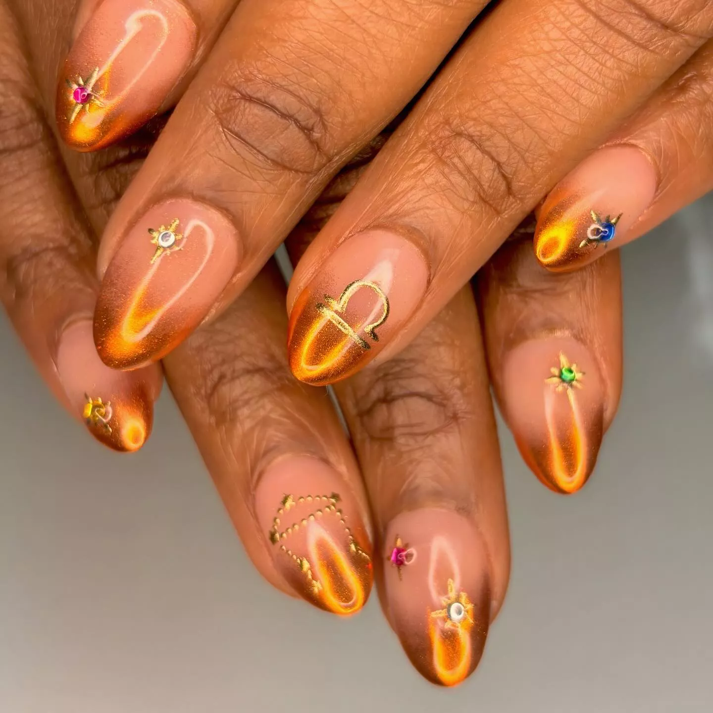 orange dip dye chrome nails with astrology art
