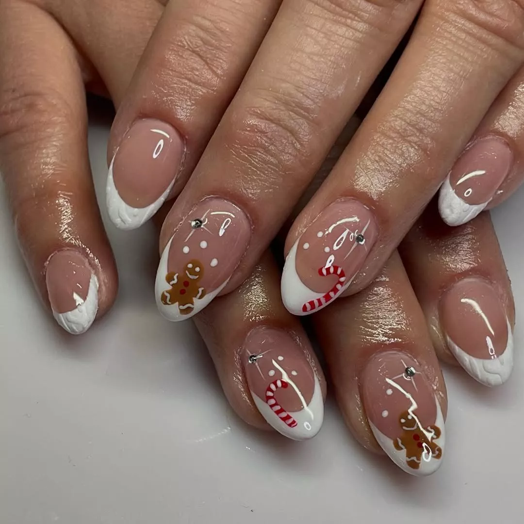French manicure with candy canes and gingerbread men