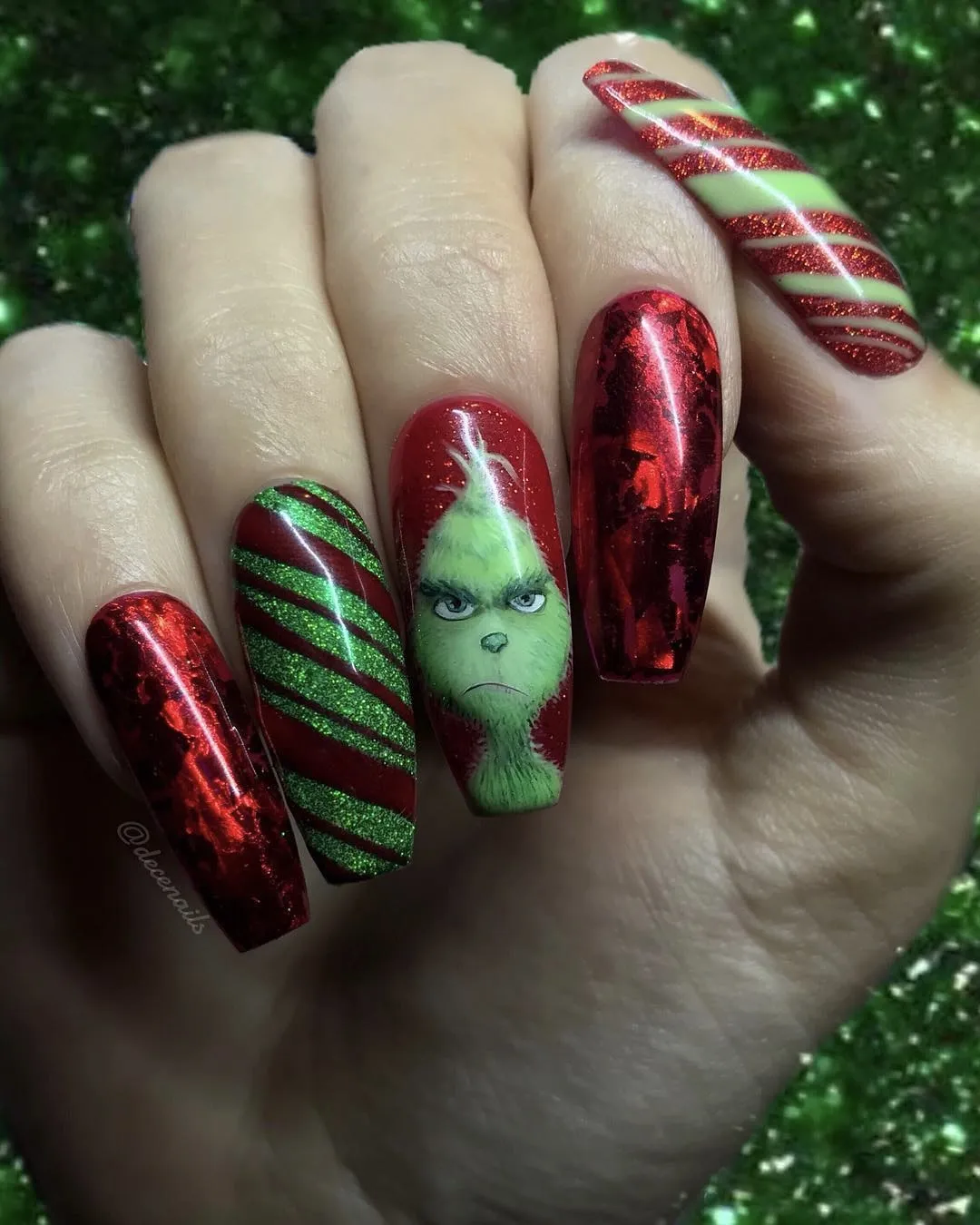 Grinch nails inspired by the 2018 film.