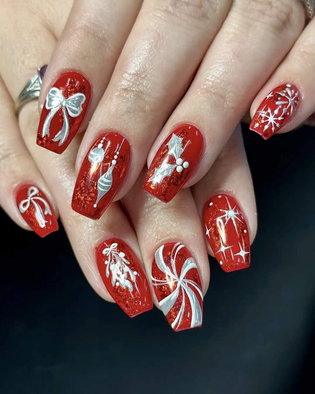 Silver and red candy cane nails.