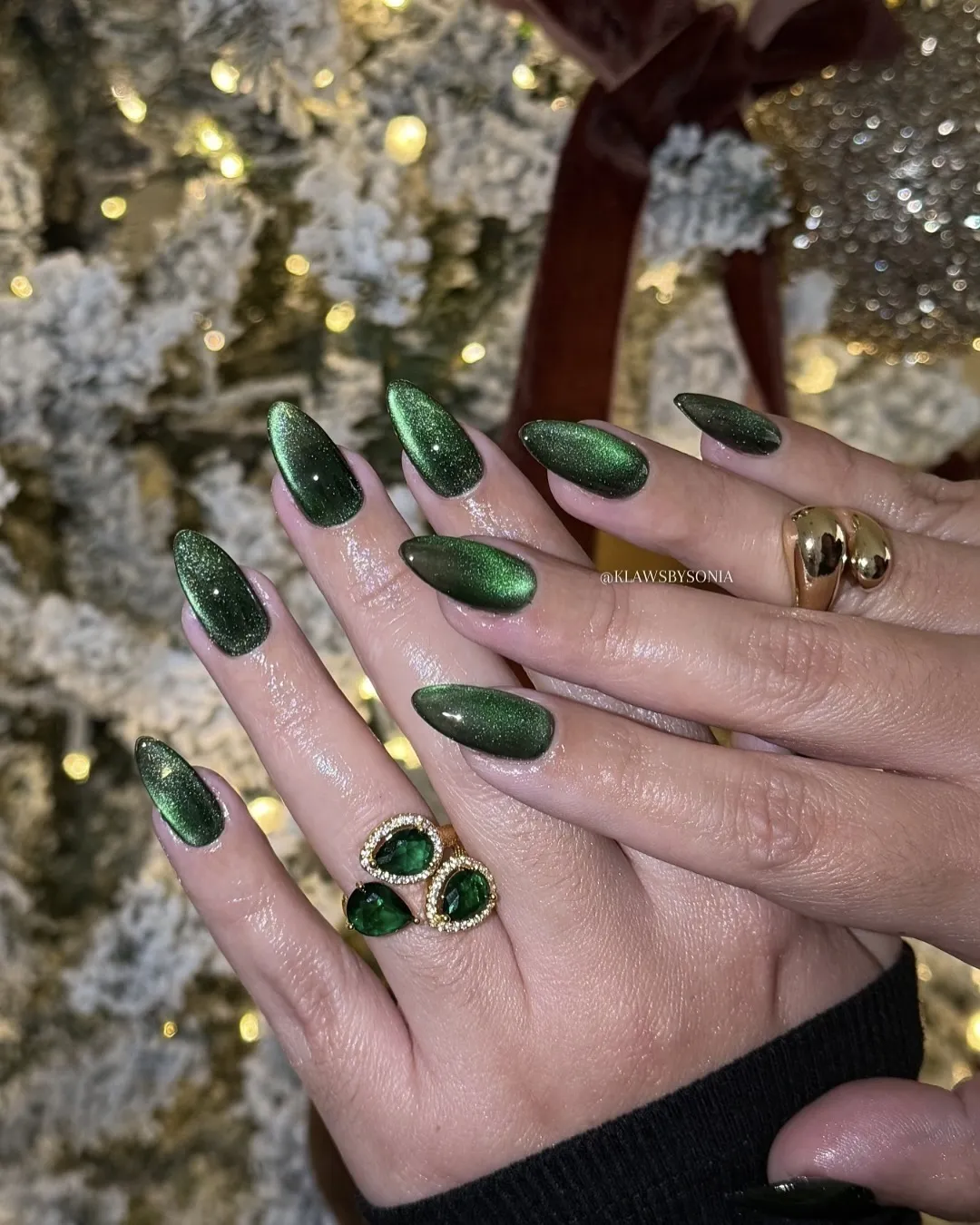 Dark green velvet nails.