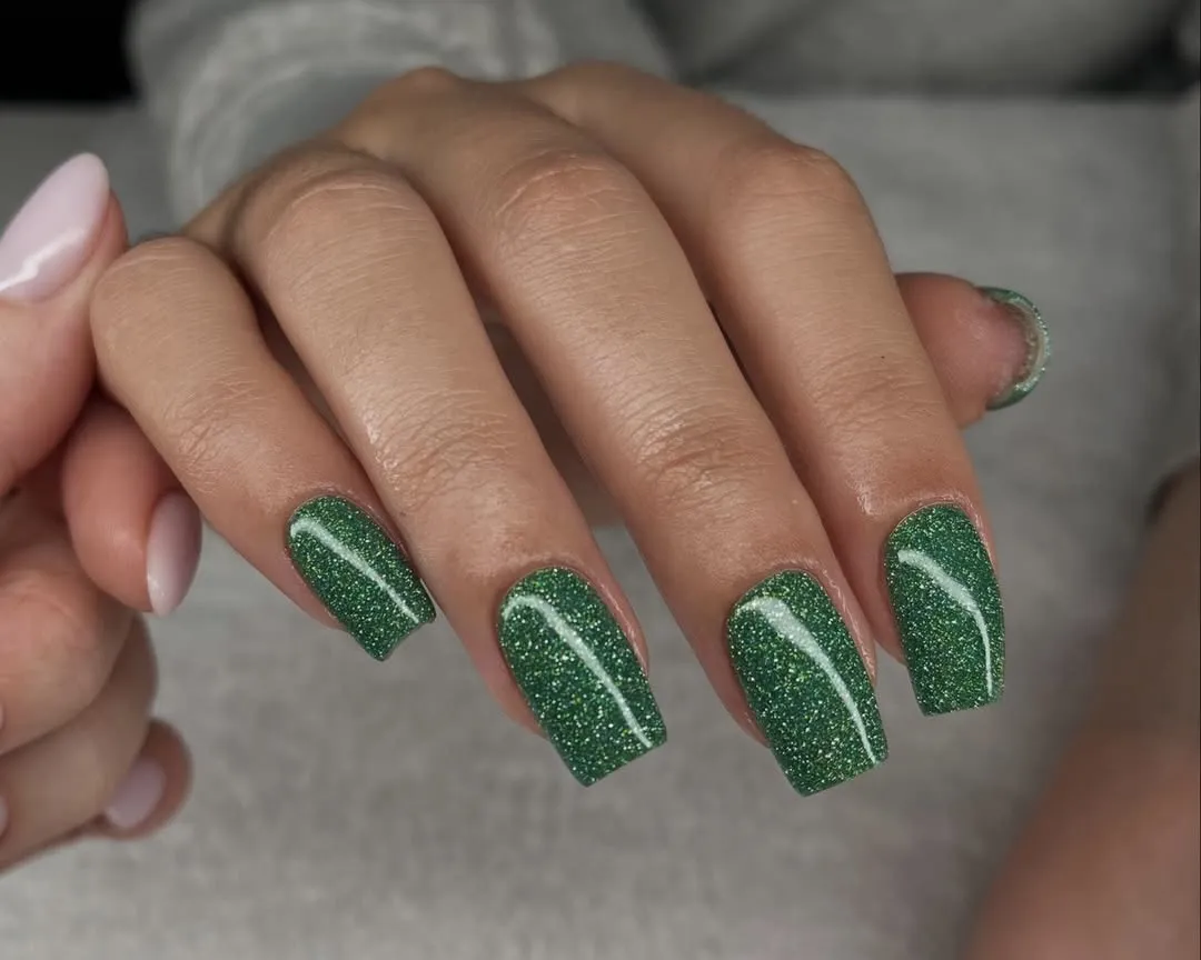Glittery green nail polish.