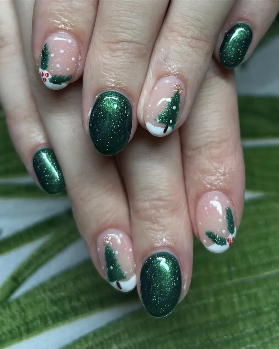 Green glittery nail polish with sheer snowy accent nails featuring mistletoe and Christmas trees.