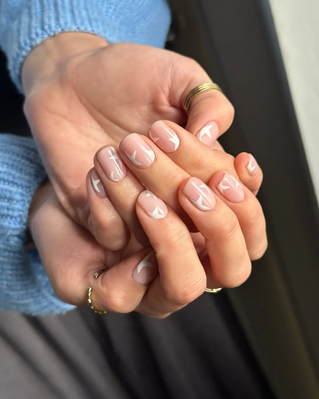 Short nude nails with white star accents