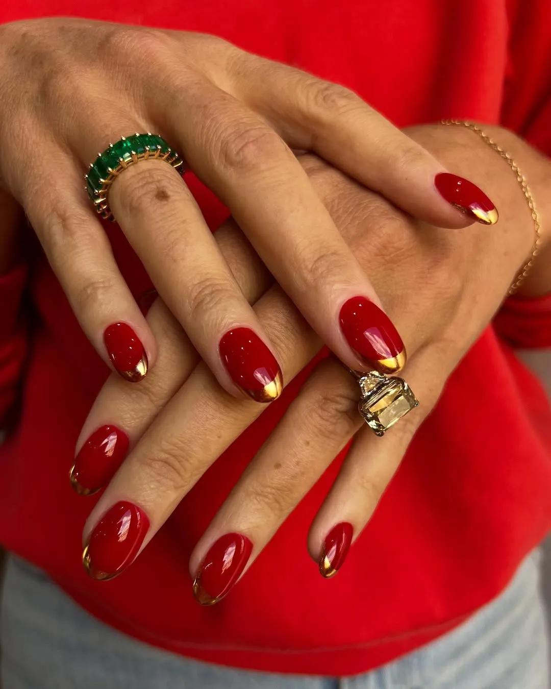 Closeup of hands with manicured nails and statement rings