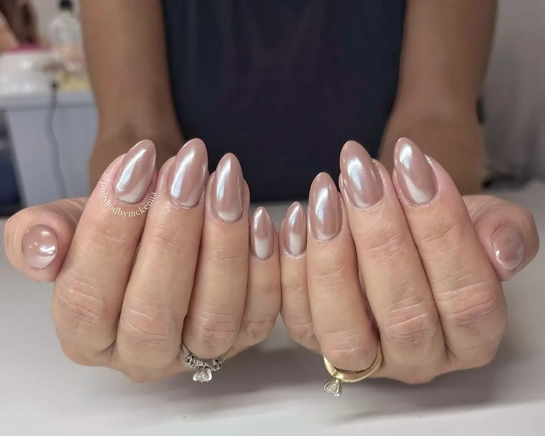 Chrome-finish light brown neutral nails.