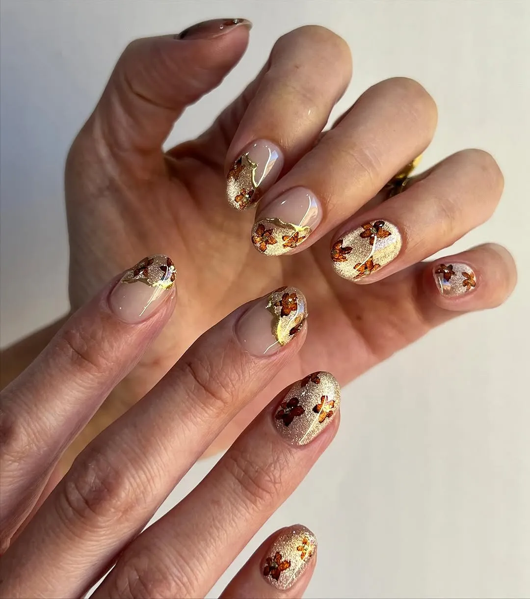 Hands showing nails with a patterned design