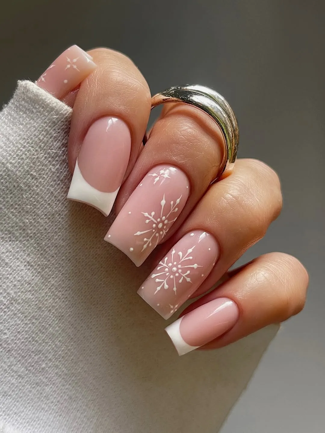 French manicure with snowflake accents