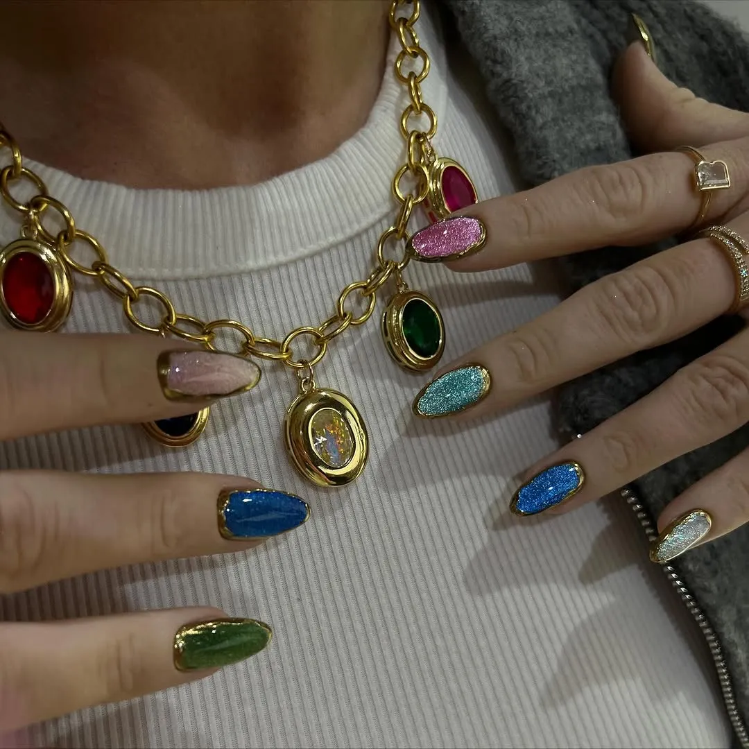 Multicolored cat-eye nails with gold chrome outlines