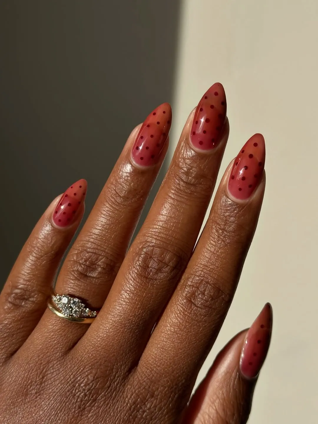 Red jelly nails with red polka dots