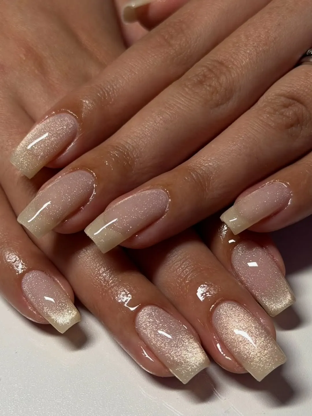 Sheer nude cat-eye nails