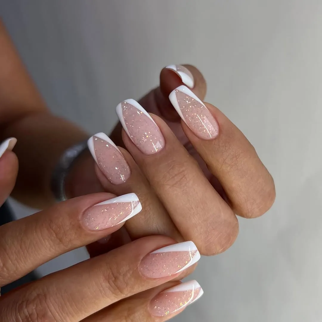 V-shaped French tips with a sheer glittery base