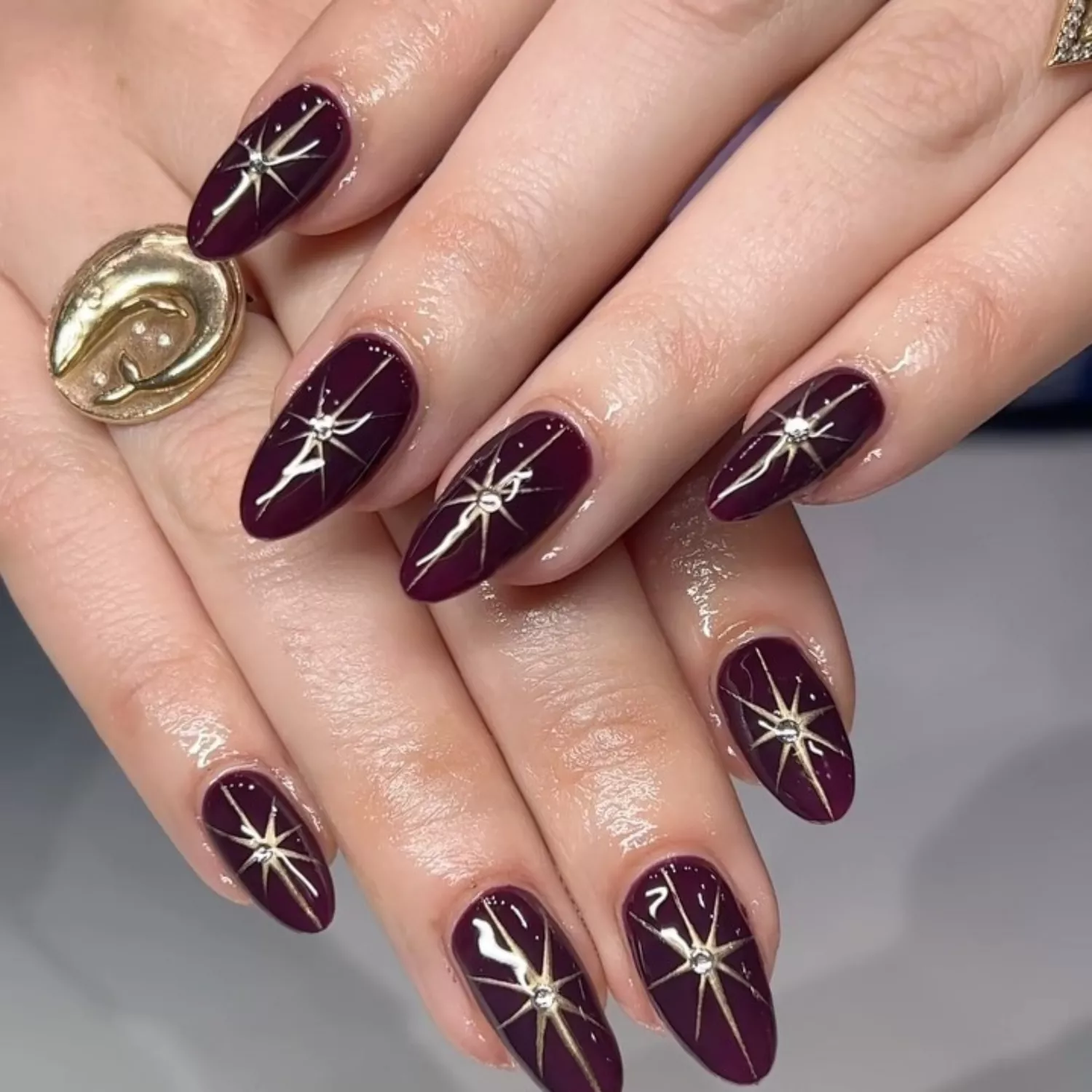 Festive Gold Chrome Star Cranberry Nails - InStyle December Nails 