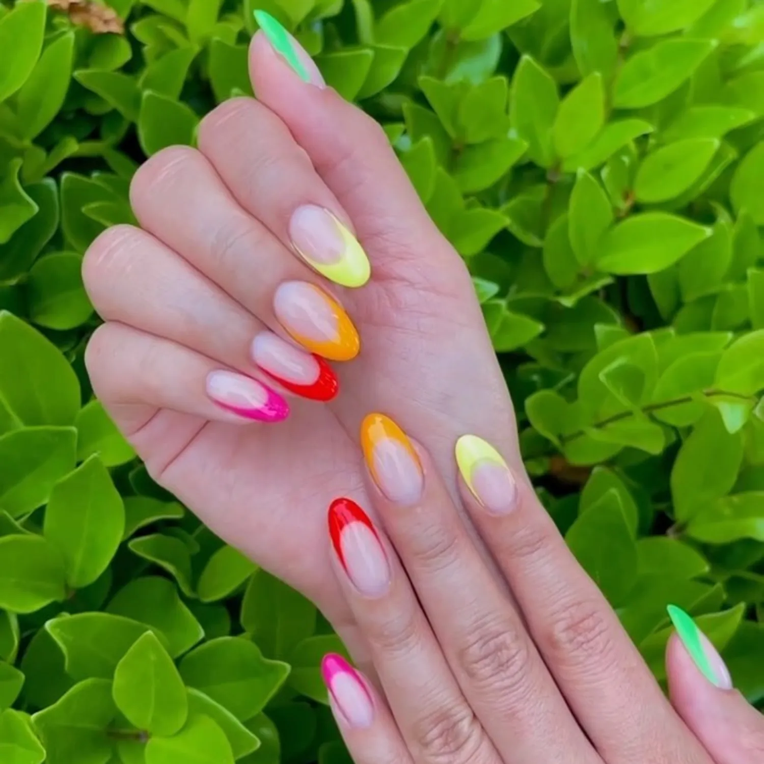 Rainbow French manicure on almond-shaped nails