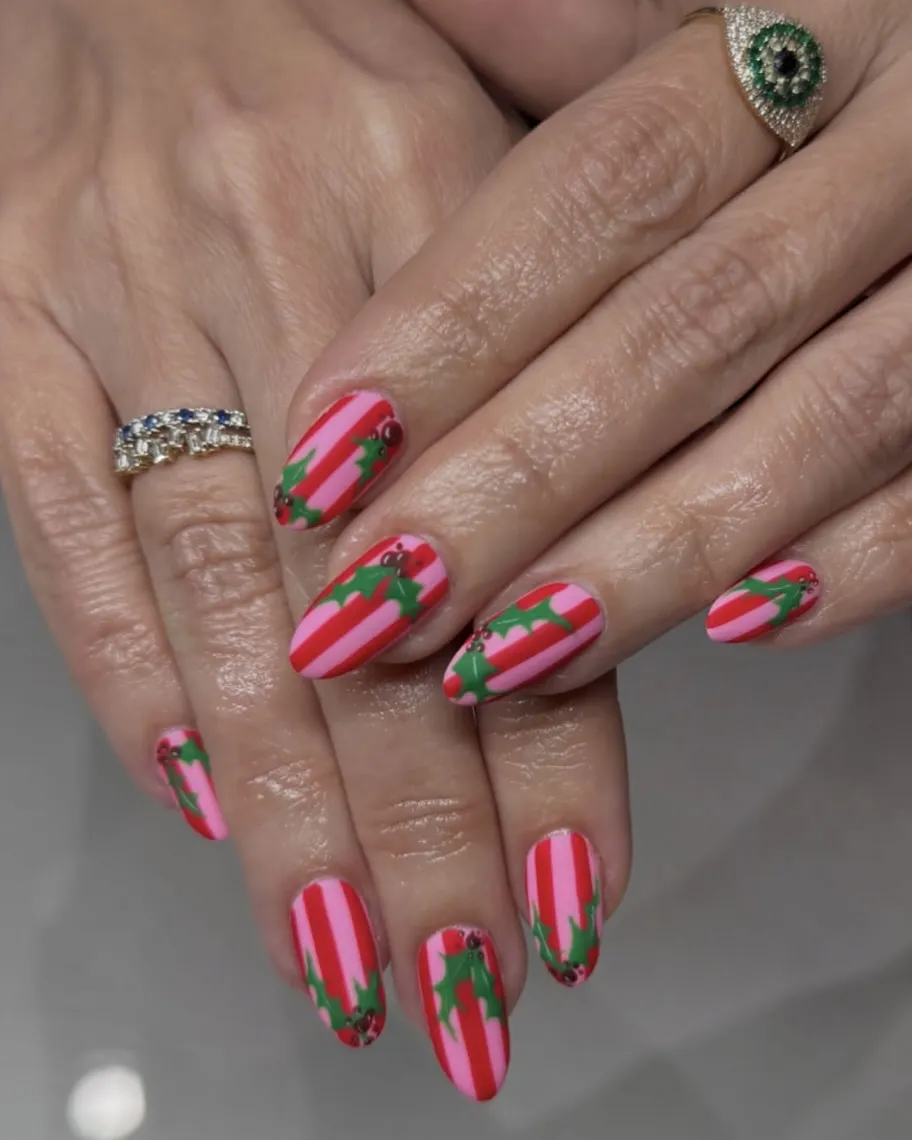 Pink and red striped Christmas nails.