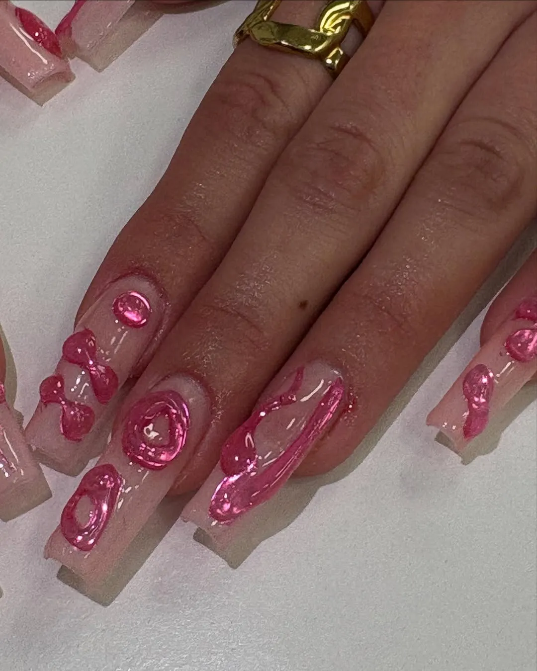 Light pink gel extensions with hot pink builder gel designs