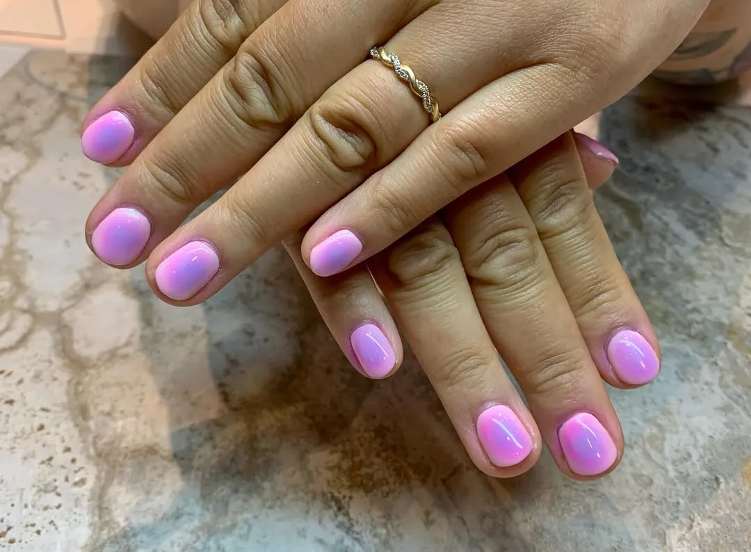 Light pink aura nails with a purple center