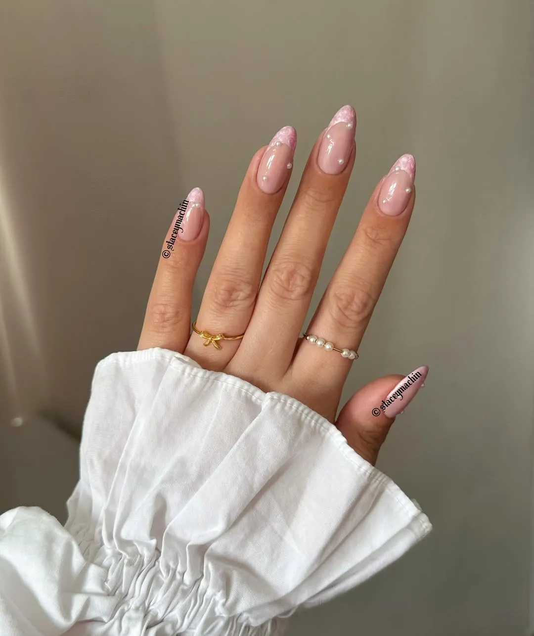 Pearly pink french nails with pearls appliques 