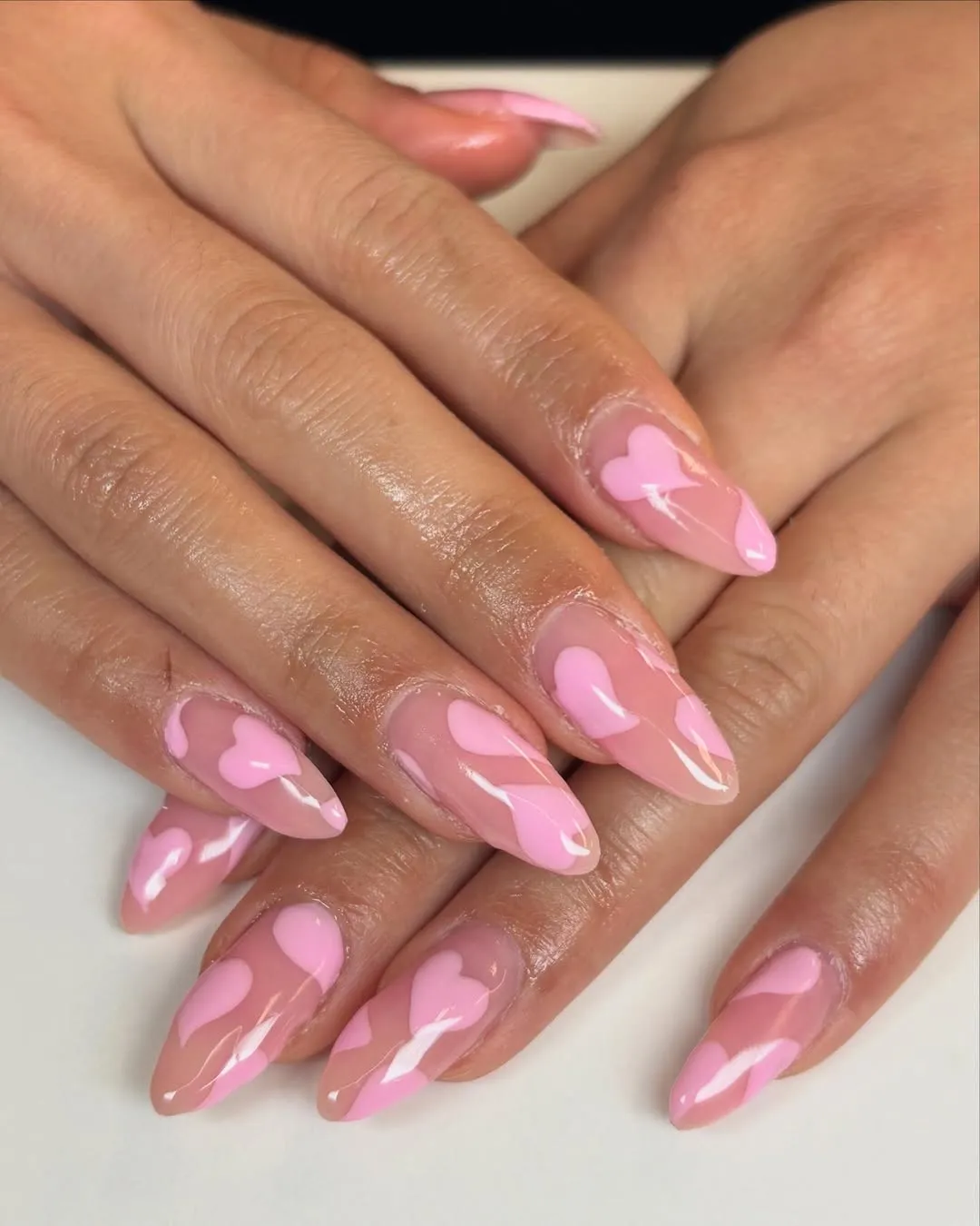 Nude nails with light pink hearts