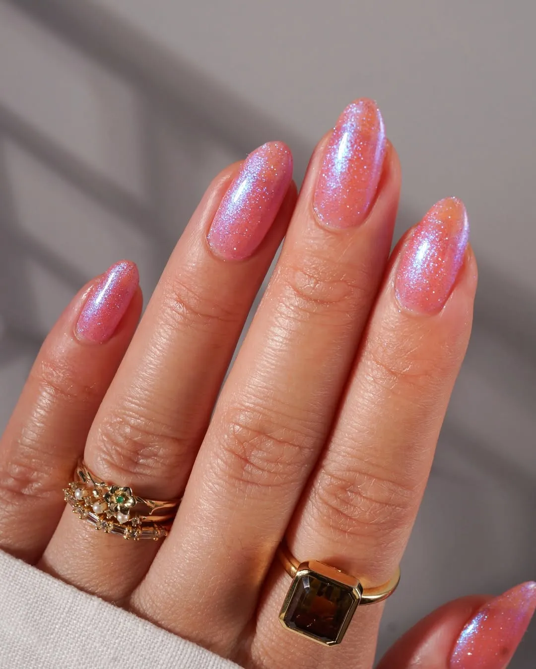 Sparkly light pink almond nails
