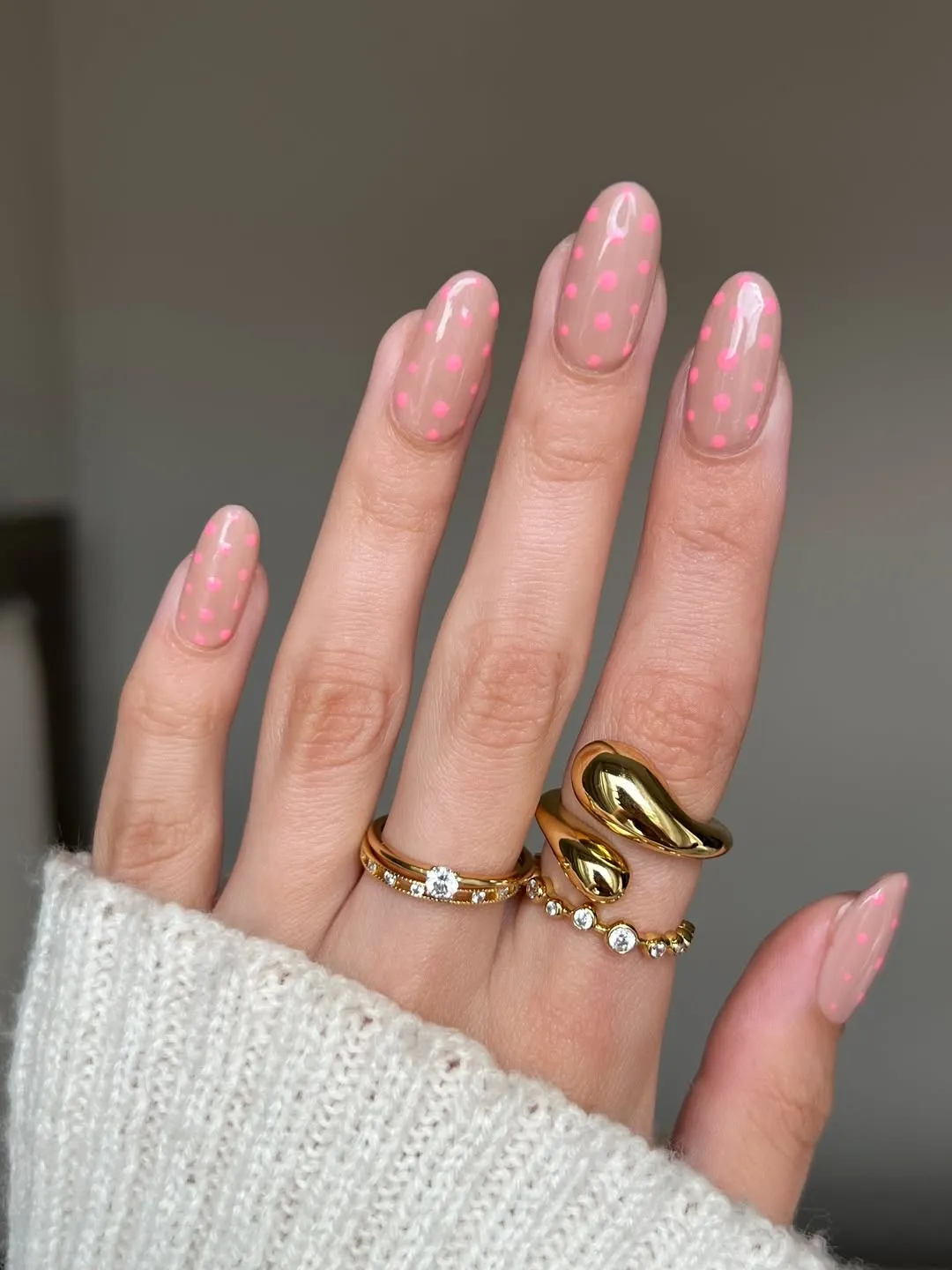 Nude nails with light pink polka dots