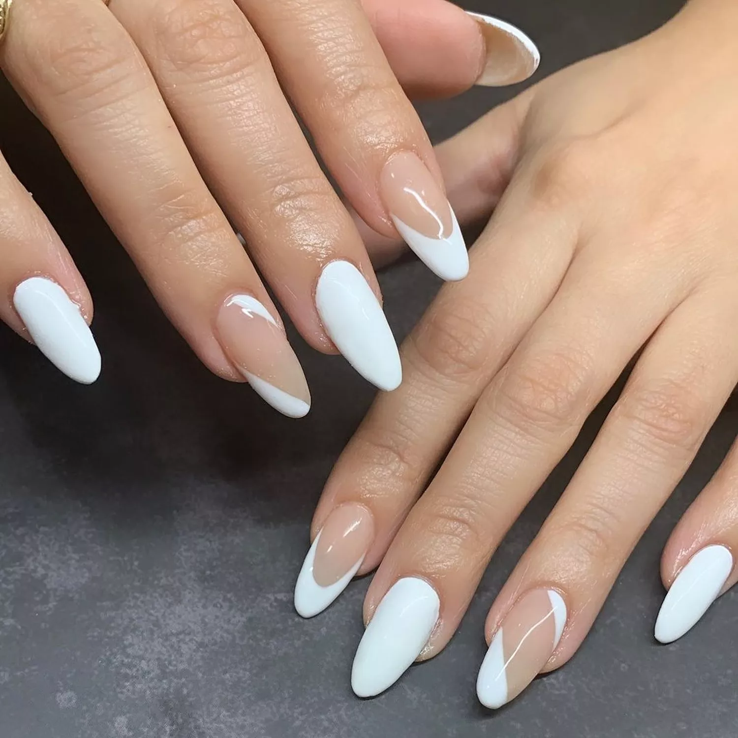 White almond French manicure with diagonal negative space accents