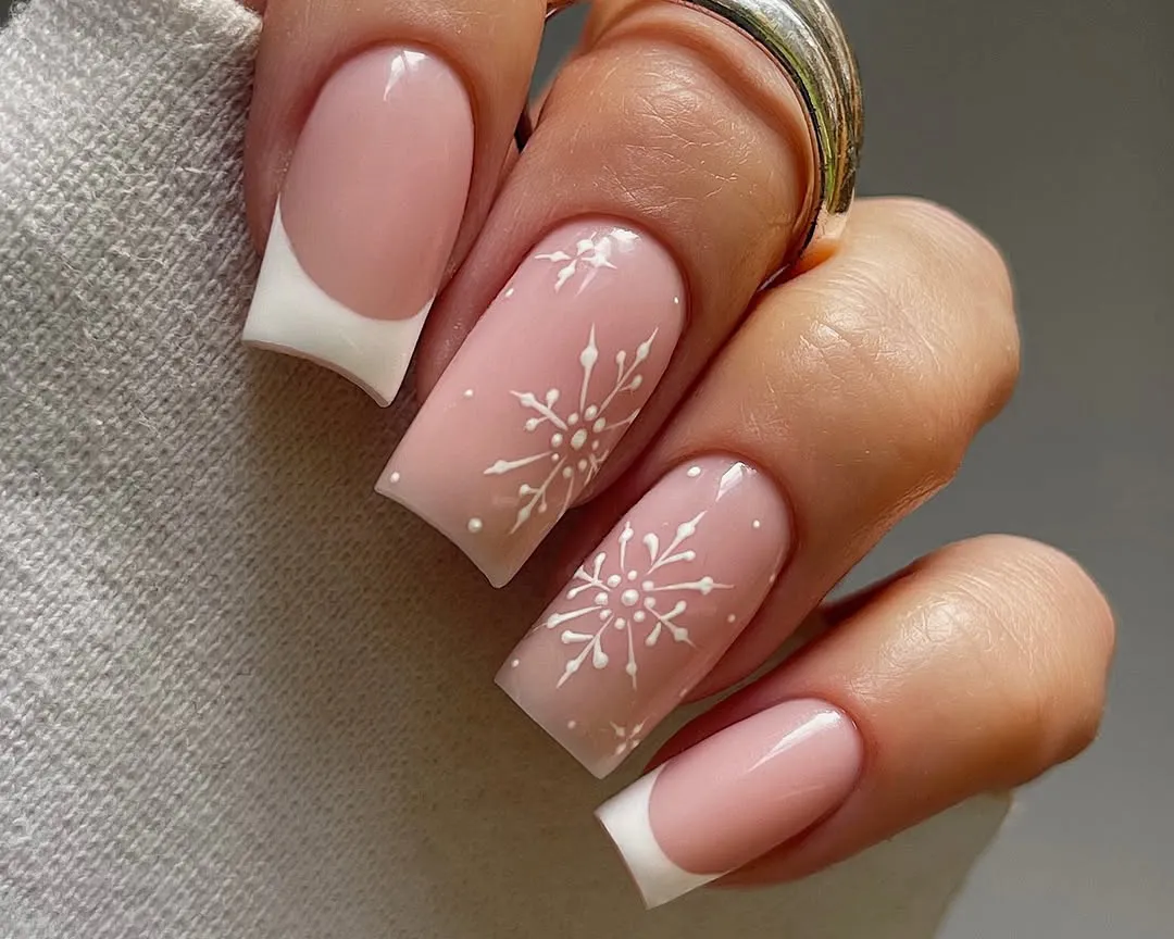 French manicure with snowflake accents