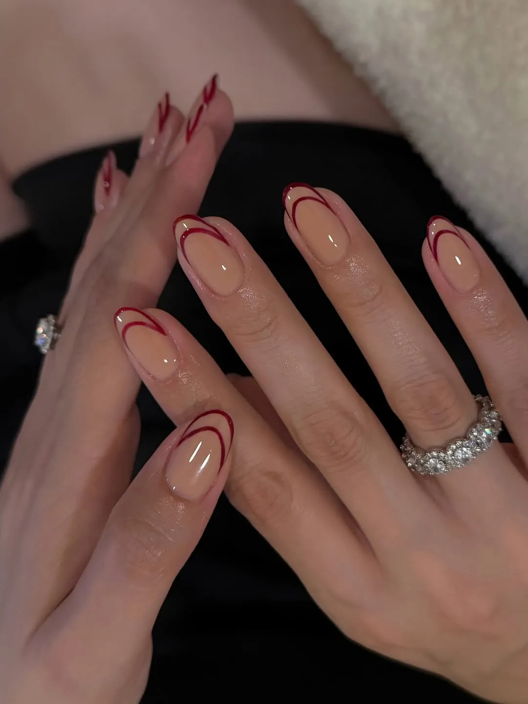 A person showing off a double French manicure
