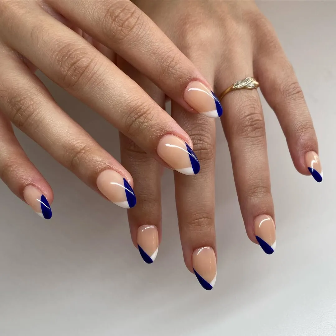 A person showing off a two-tone French of white and navy