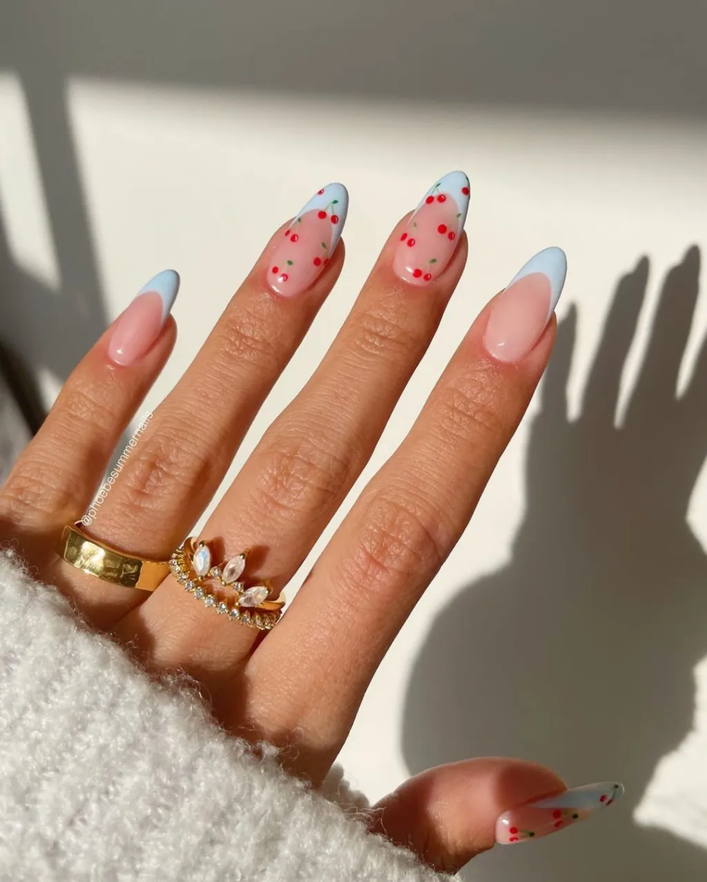 cute red cherry nails with pastel blue french tip designs
