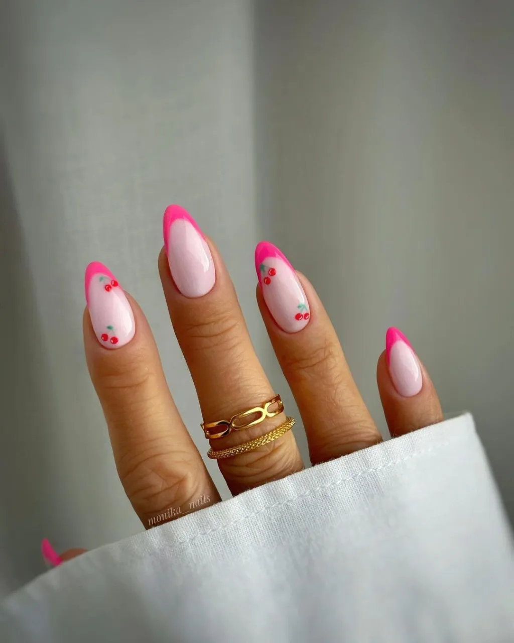 hot pink french manicure with cute red fruit designs