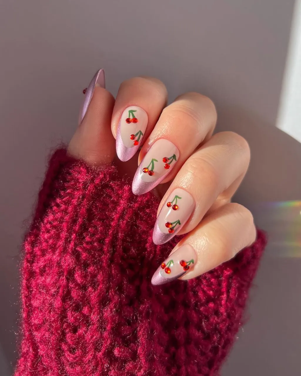 cute red rhinestone cherry nails with shimmery pink french tip designs