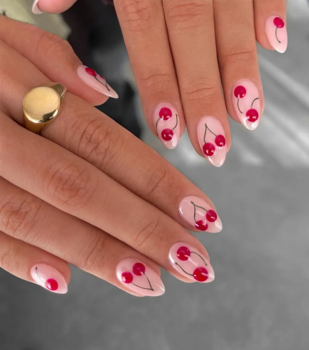 cute simple almond shaped nails with red 3D cherry designs