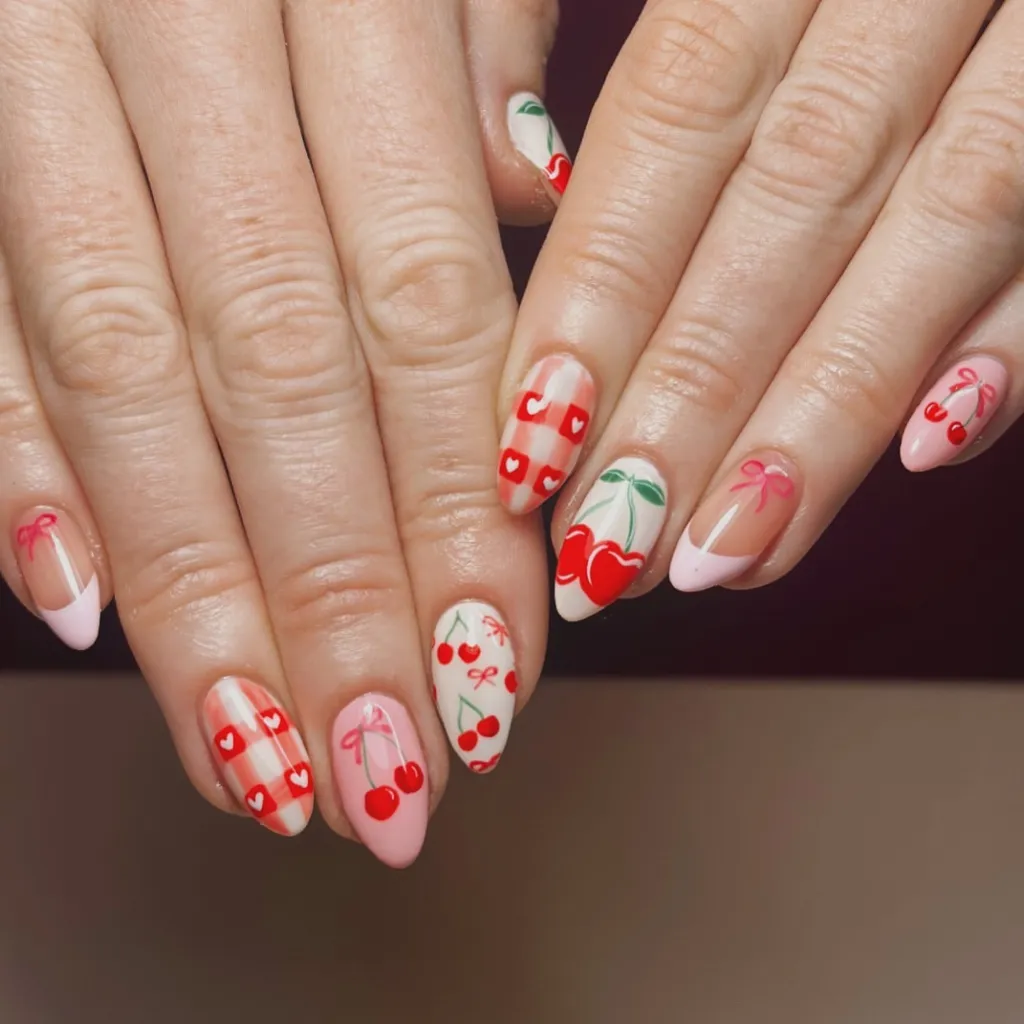 mismatched red and pink cherry nail design with cute gingham patterns