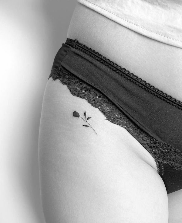 Simple small rose hip tattoo by @mrs.tattoo