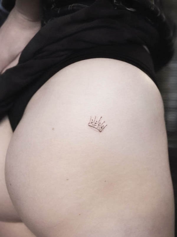 Tiny crown hip tattoo by @jt_tattoo