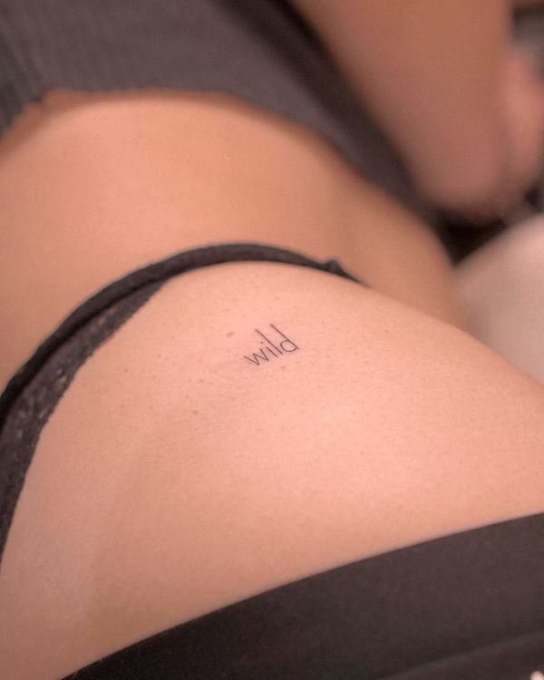 Wild one word hip tattoo by @sabyminaart