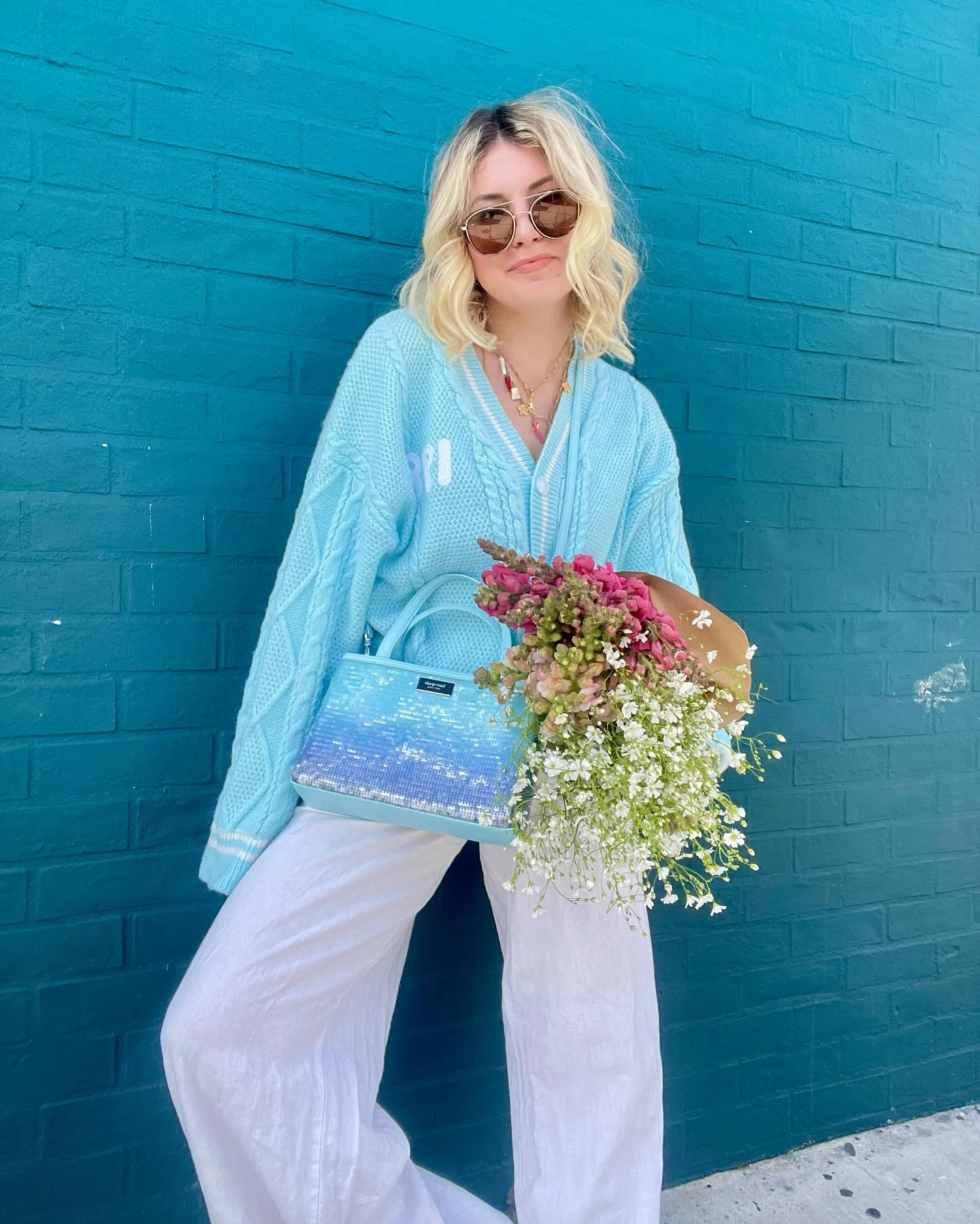 Baby Blue Cable Knit Cardigan With White Linen Trousers
